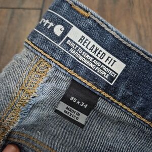 Carhartt Relaxed Fit Men's Denim Jeans in Blue with Gold Stitching